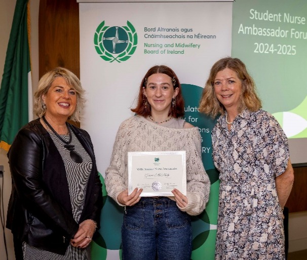 A group of women standing next to each otherDescription automatically generated