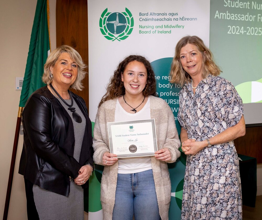 A group of women standing next to each otherDescription automatically generated