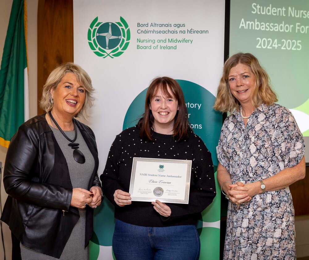 A group of women standing next to each otherDescription automatically generated