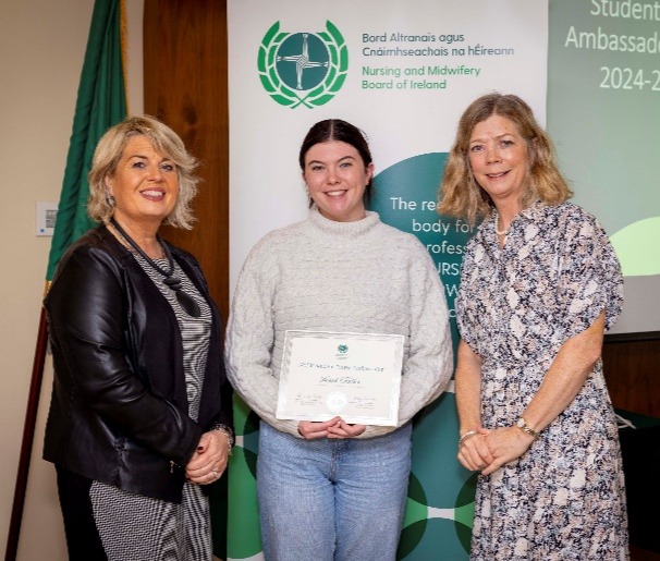 A group of women standing next to each otherDescription automatically generated